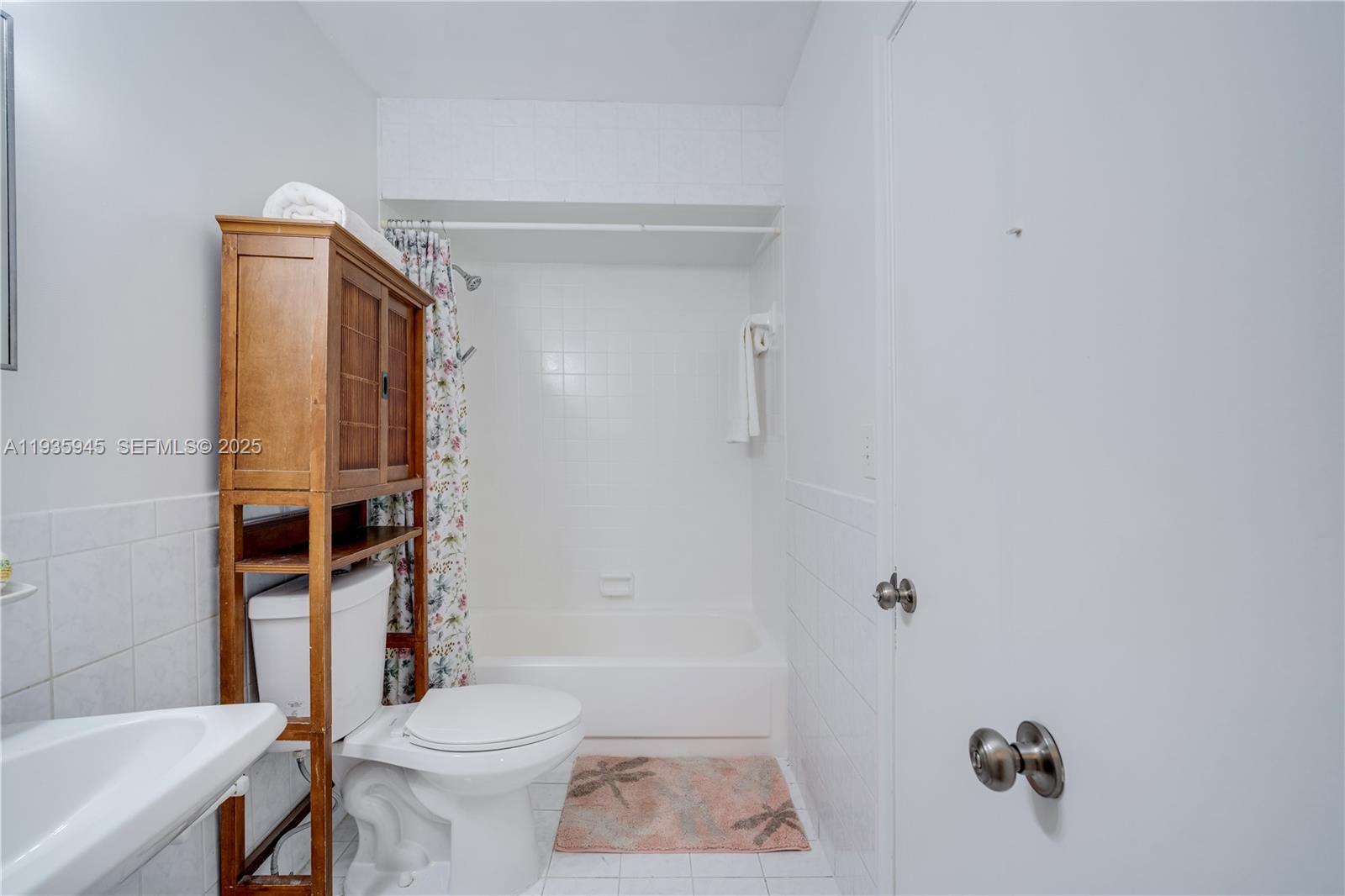 11483 Southwest 109th Road, Unit 2E Miami, FL 33176 - Photo 21 of 45 a bathroom with a toilet and a shower