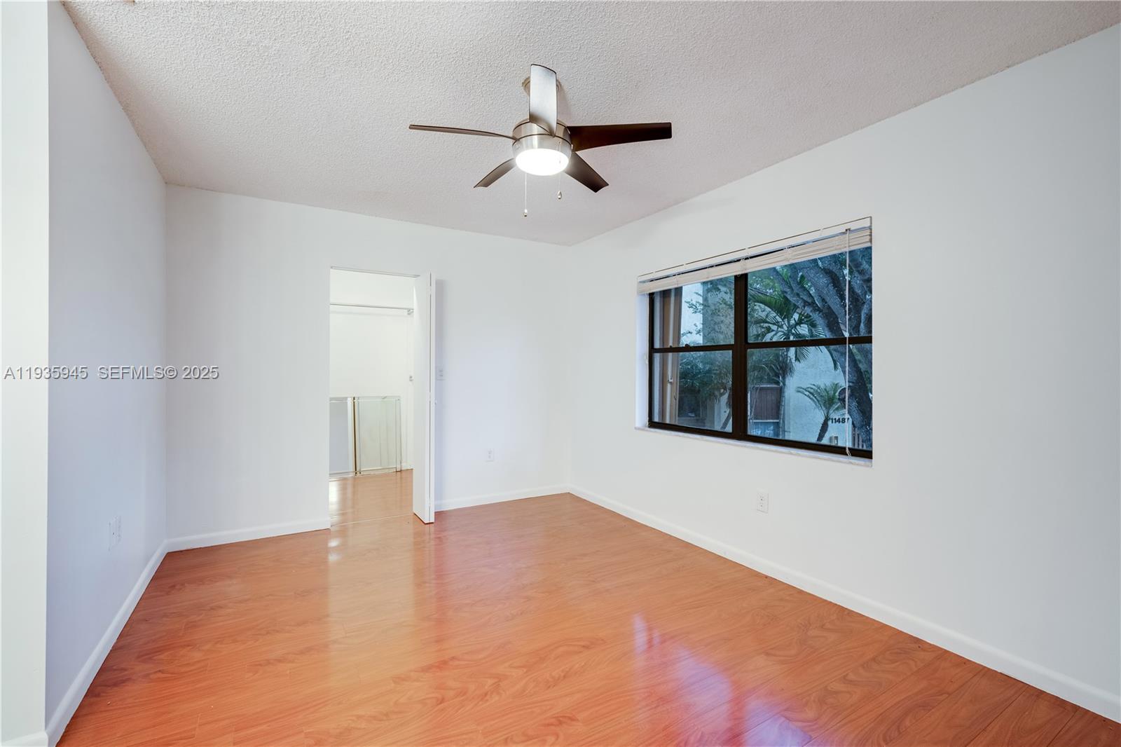 11483 Southwest 109th Road, Unit 2E Miami, FL 33176 - Photo 26 of 45 a view of an empty room with a window