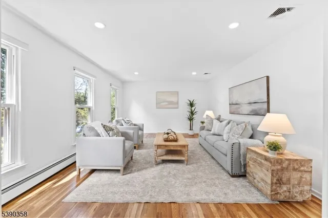 a living room with furniture and a lamp