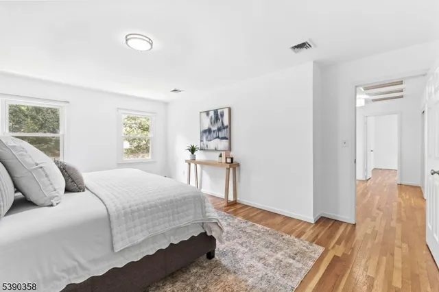 a bedroom with a bed and a table in it