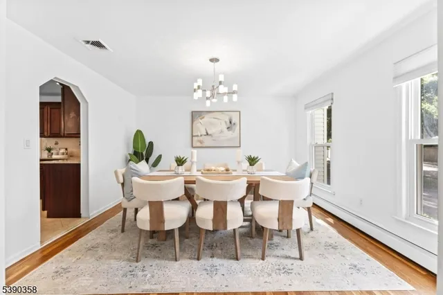 a view of a dining room with furniture window and wooden floor