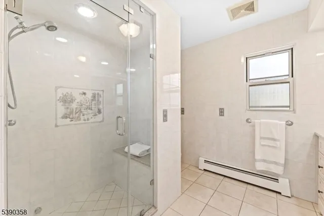 a bathroom with a granite countertop sink a toilet and a mirror