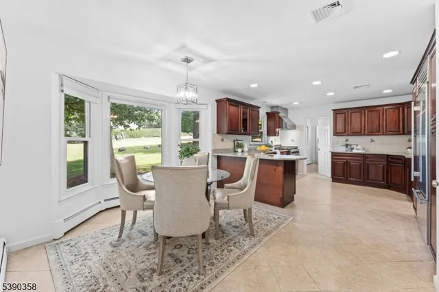 a living room with kitchen furniture and a wooden floor