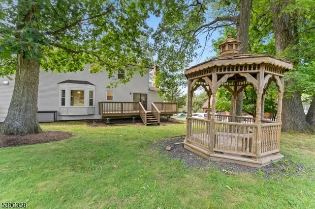 a view of a wooden deck with a yard