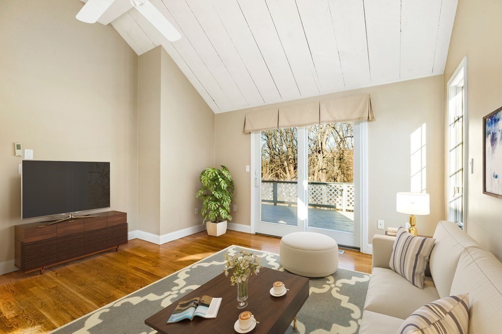 70 Thistle Patch Way, Unit 70 Hingham, MA 02043 - Photo 12 of 41 a living room with furniture and a flat screen tv
