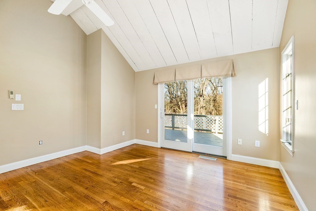 70 Thistle Patch Way, Unit 70 Hingham, MA 02043 - Photo 13 of 41 a view of an empty room with wooden floor and a window