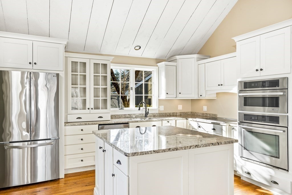 70 Thistle Patch Way, Unit 70 Hingham, MA 02043 - Photo 15 of 41 a kitchen with granite countertop stainless steel appliances and wooden cabinets