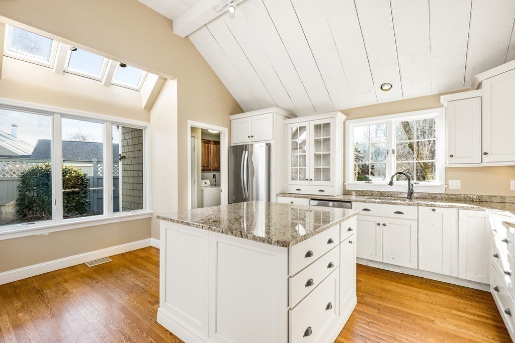 70 Thistle Patch Way, Unit 70 Hingham, MA 02043 - Photo 17 of 41 a large white kitchen with a large window