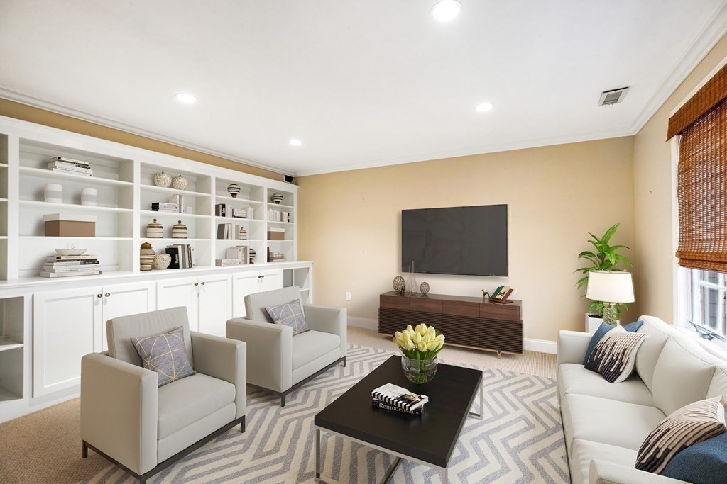 70 Thistle Patch Way, Unit 70 Hingham, MA 02043 - Photo 29 of 41 a living room with furniture and a flat screen tv