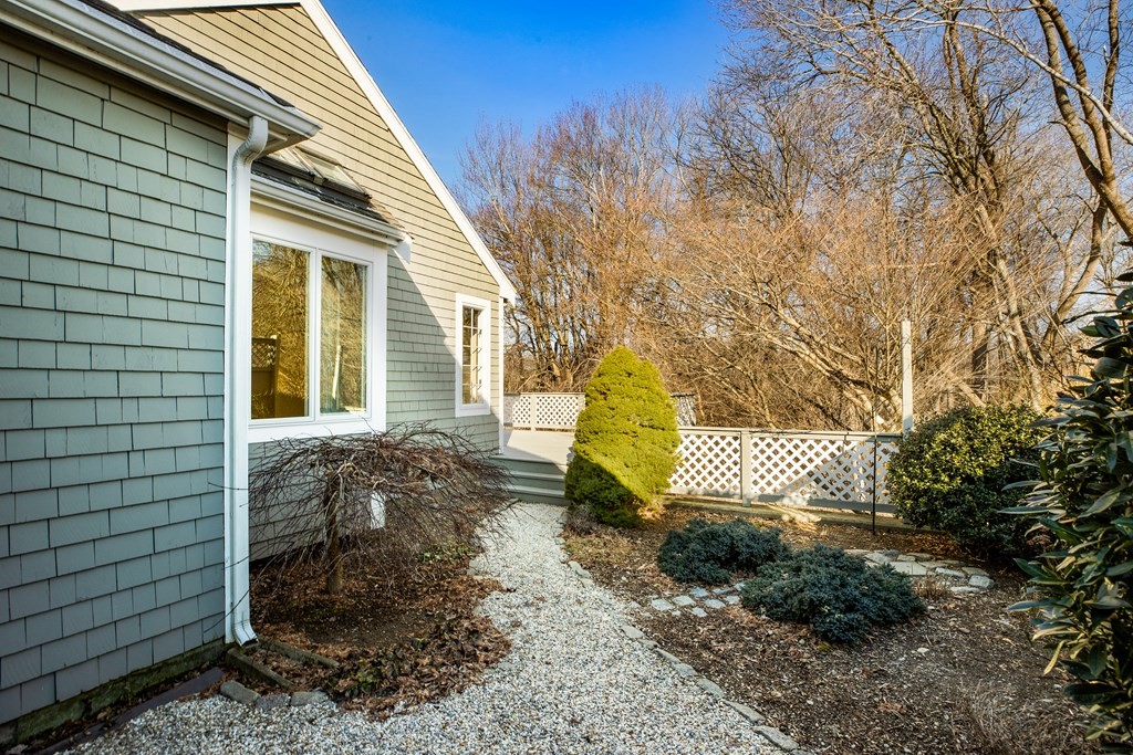 70 Thistle Patch Way, Unit 70 Hingham, MA 02043 - Photo 3 of 41 a view of a house with a yard and wooden fence