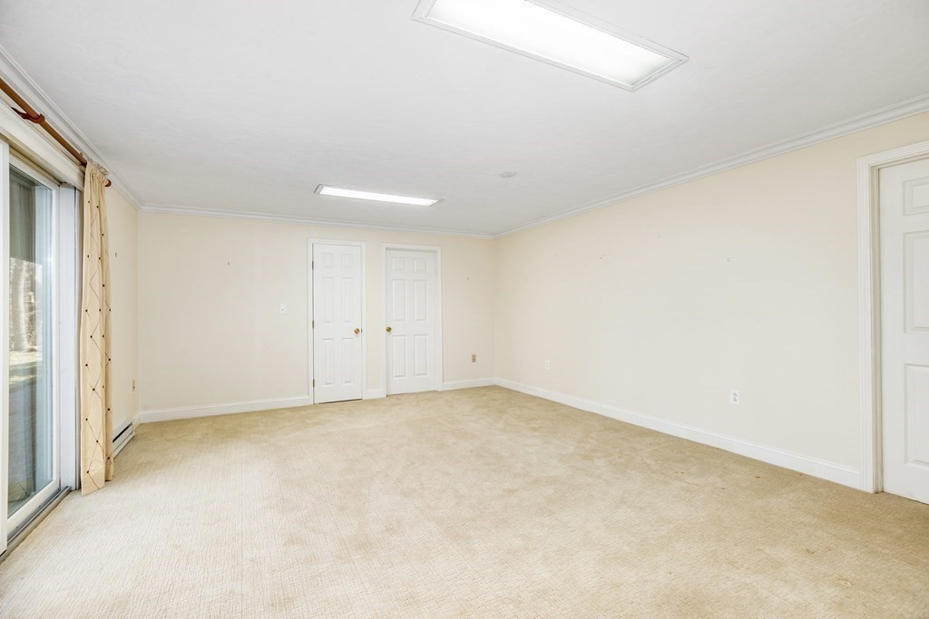 70 Thistle Patch Way, Unit 70 Hingham, MA 02043 - Photo 33 of 41 an empty room with an entryway