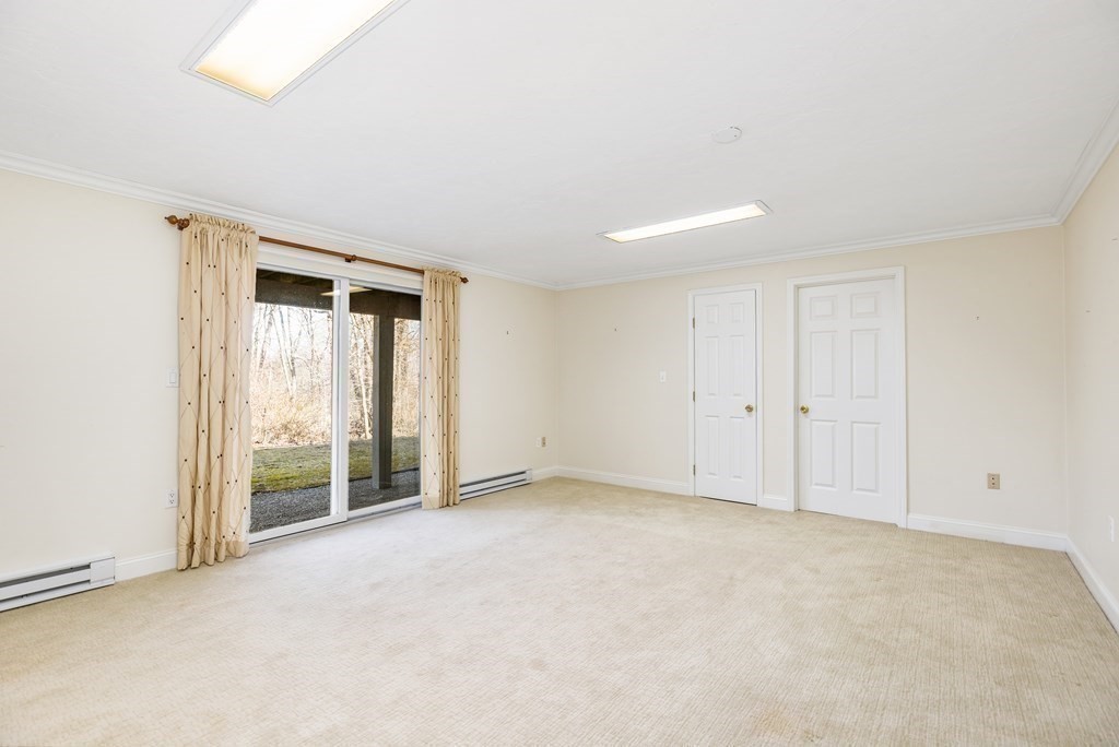70 Thistle Patch Way, Unit 70 Hingham, MA 02043 - Photo 34 of 41 a view of an empty room with a window