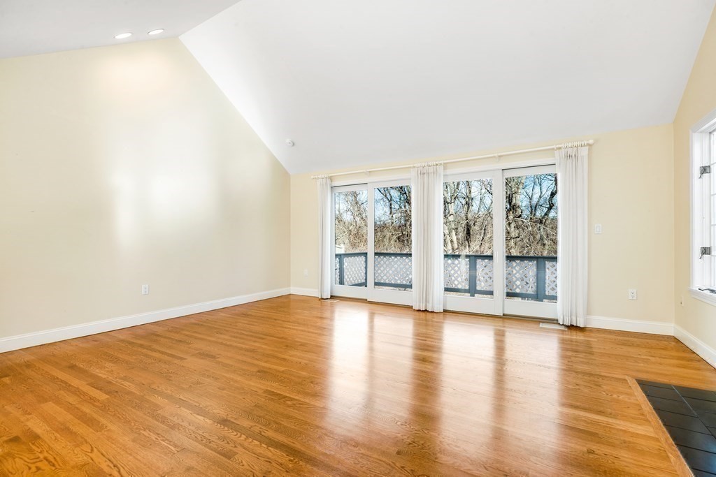 70 Thistle Patch Way, Unit 70 Hingham, MA 02043 - Photo 35 of 41 a view of an empty room with wooden floor and a window