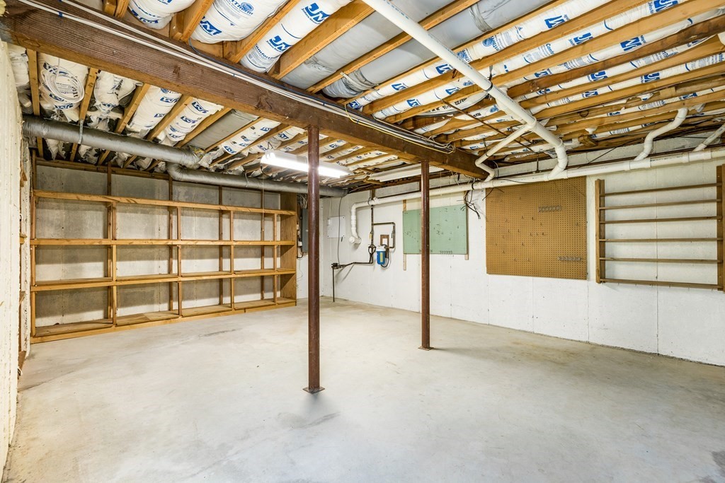 70 Thistle Patch Way, Unit 70 Hingham, MA 02043 - Photo 40 of 41 a view of an empty room with a garage