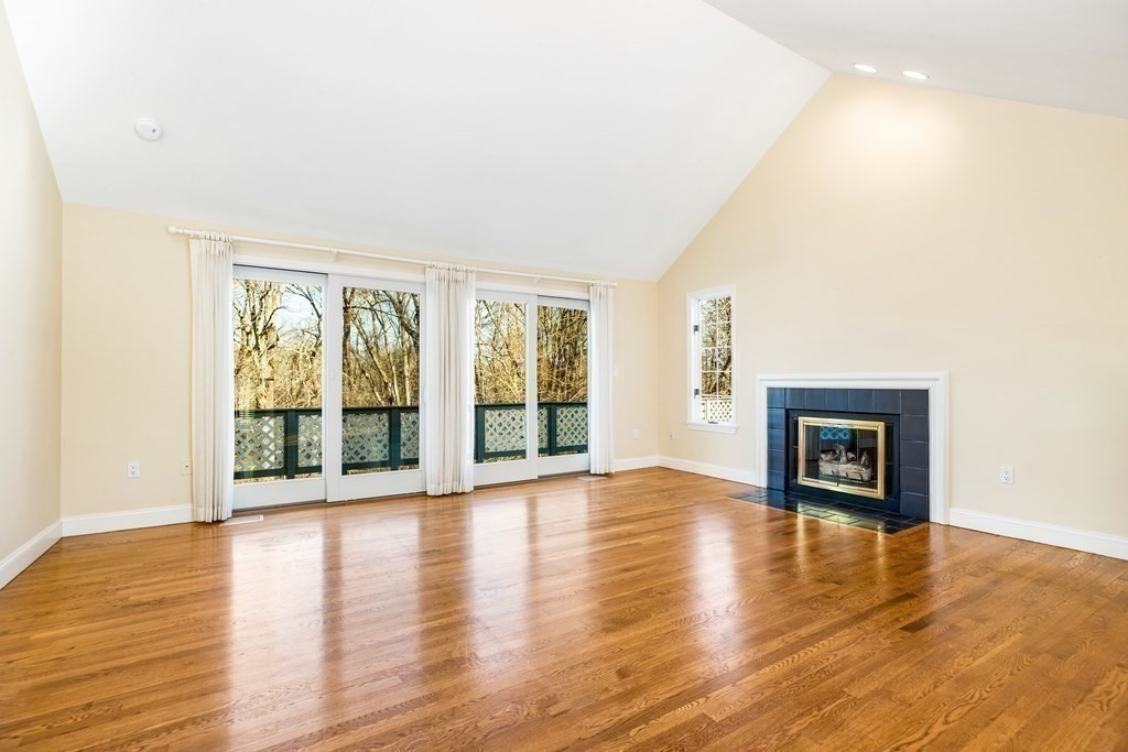70 Thistle Patch Way, Unit 70 Hingham, MA 02043 - Photo 8 of 41 a view of an empty room with wooden floor and a window