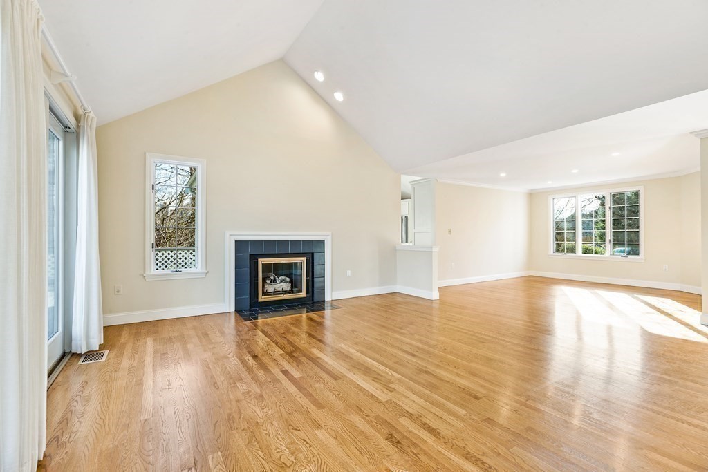 70 Thistle Patch Way, Unit 70 Hingham, MA 02043 - Photo 10 of 41 wooden floor fireplace and windows in an empty room