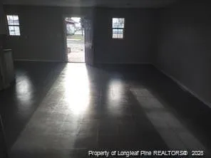 a view of an empty room and window