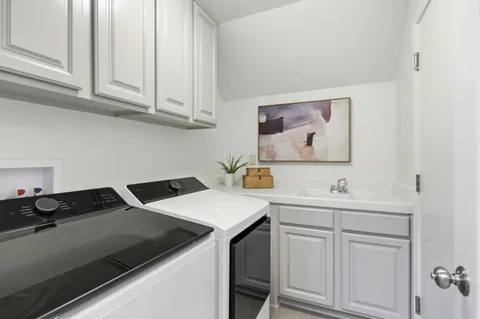 a view of a house with backyard porch and sitting area