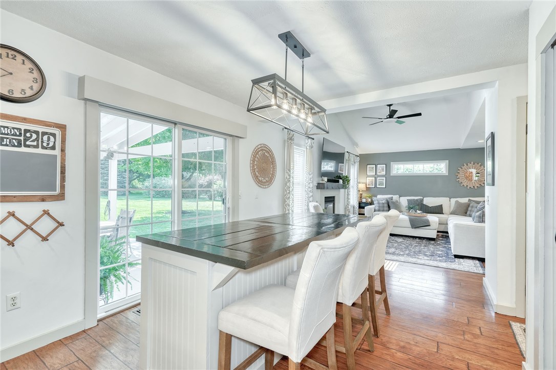 522 Salt Road Webster, NY 14580 - Photo 11 of 46 Island breakfast bar with slider out to back cover