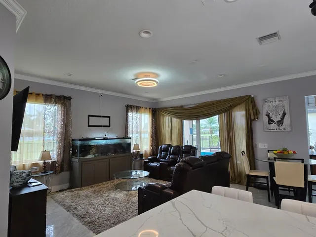 a spacious bedroom with a large bed and a large window