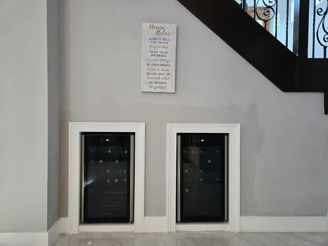 a room with furniture and a floor to ceiling window