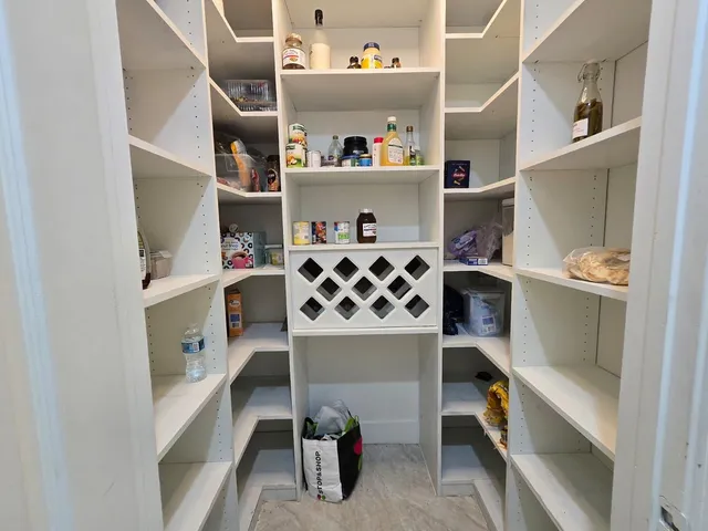 a bathroom with double vanity and a shower