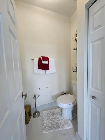 a bathroom with a double vanity sink mirror and shower