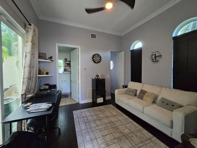 a view of a house with a yard patio and a slide