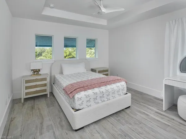 a bedroom with a bed and a table