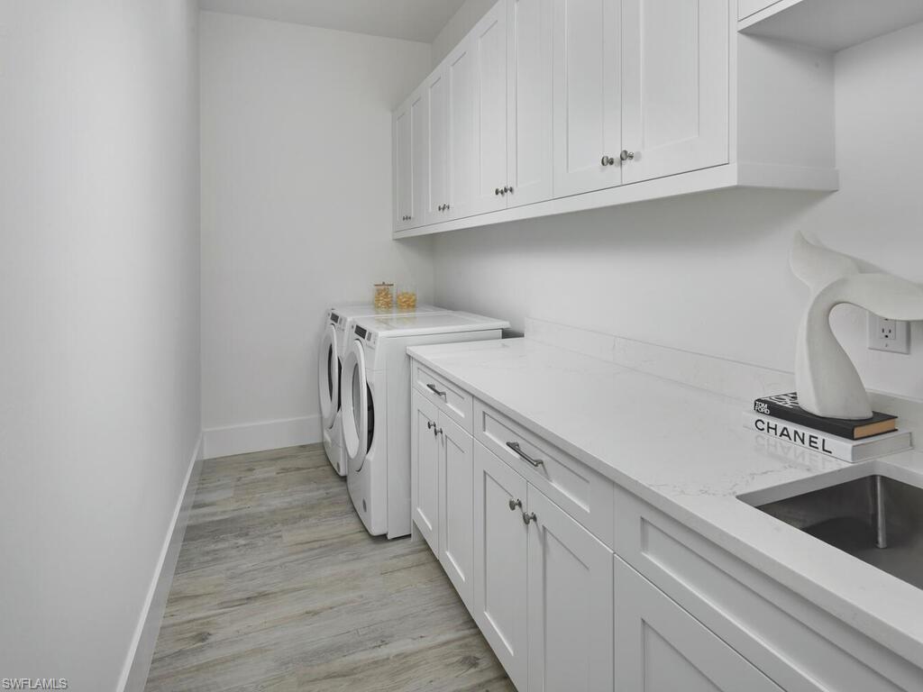 1448 10th Street North Naples, FL 34102 - Photo 13 of 18 a kitchen with a sink and cabinets