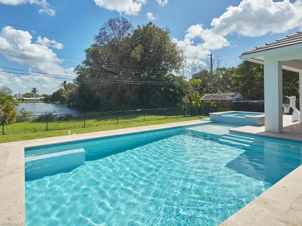 1448 10th Street North Naples, FL 34102 - Photo 17 of 18 a view of an outdoor space and swimming pool