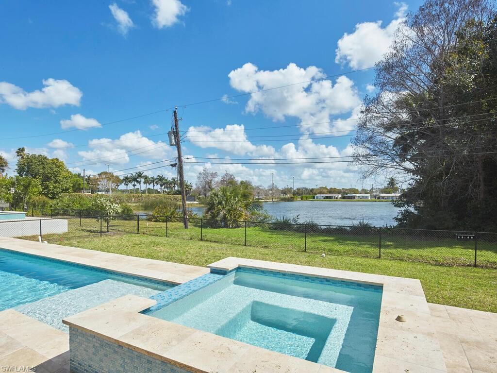 1448 10th Street North Naples, FL 34102 - Photo 18 of 18 a view of a golf course with a lake view