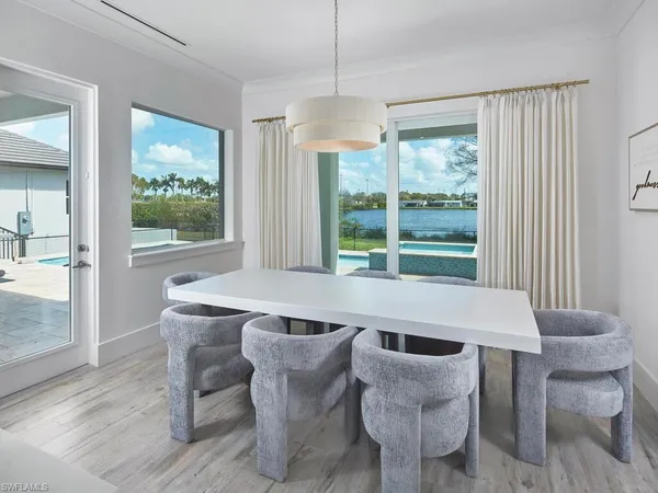 a dining room with furniture and window