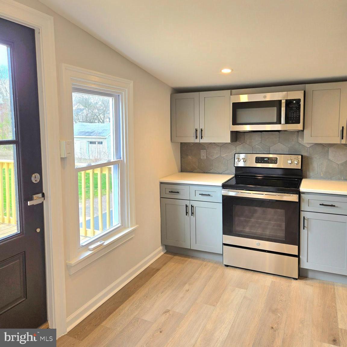 119 Chestnut Street, Unit 2 Spring City, PA 19475 - Photo 1 of 23 a kitchen with stainless steel appliances granite countertop a stove a sink and a microwave