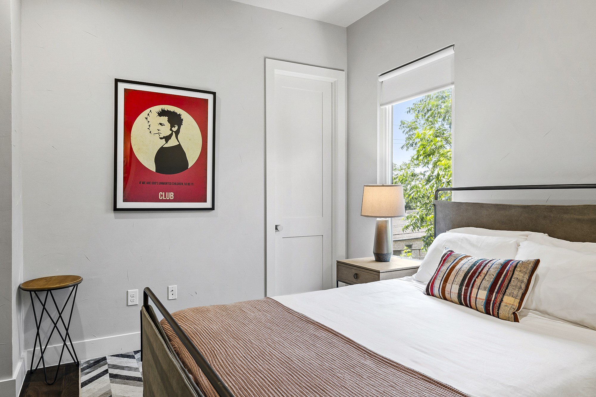 2414 Kinney Road Austin, TX 78704 - Photo 20 of 40 a bedroom with a bed and a painting on the wall