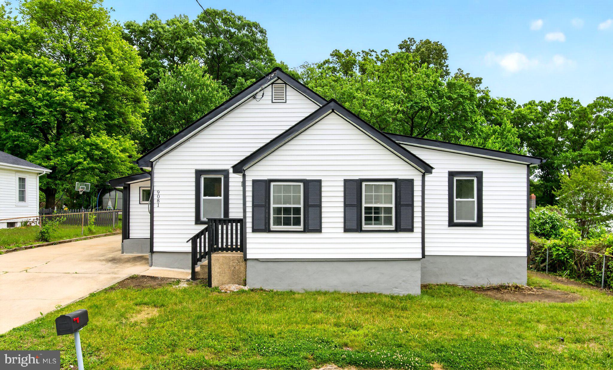 9081 Dumhart Road Laurel, MD 20723 - Photo 1 of 45 Charming home with lush greenery backdrop.