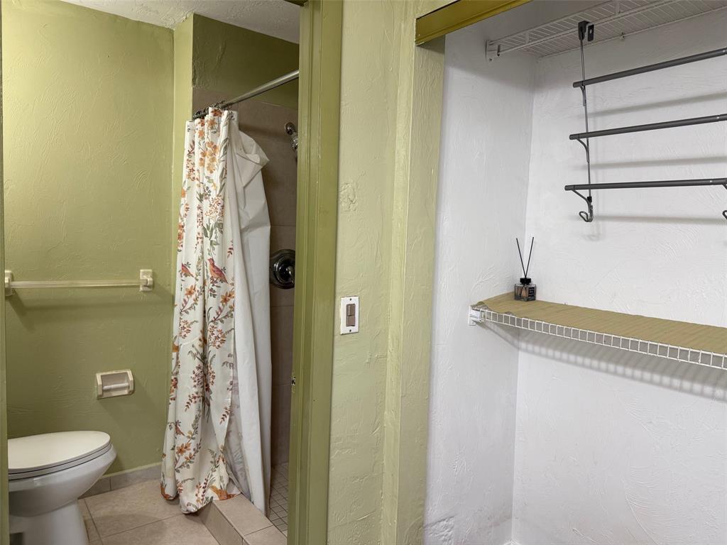 11571 Northwest 35th Street, Unit 11571 Coral Springs, FL 33065 - Photo 11 of 29 a bathroom with a shower and a toilet