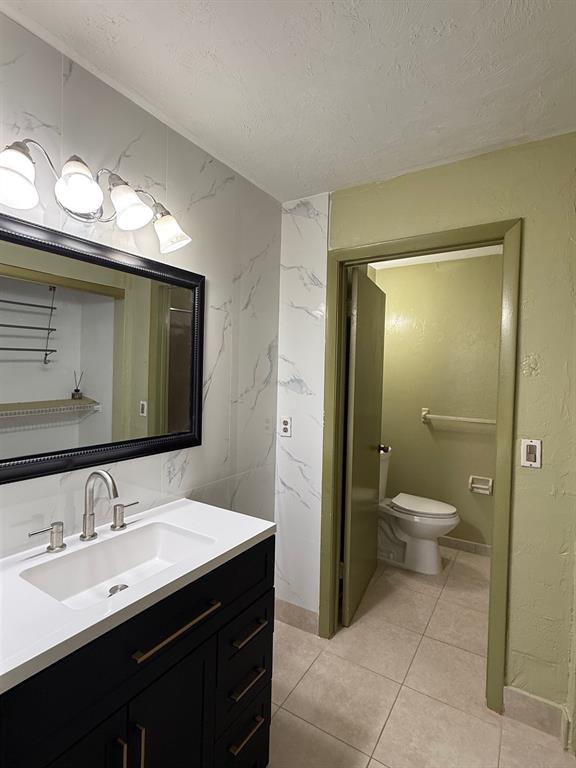 11571 Northwest 35th Street, Unit 11571 Coral Springs, FL 33065 - Photo 12 of 29 a bathroom with a toilet sink and mirror