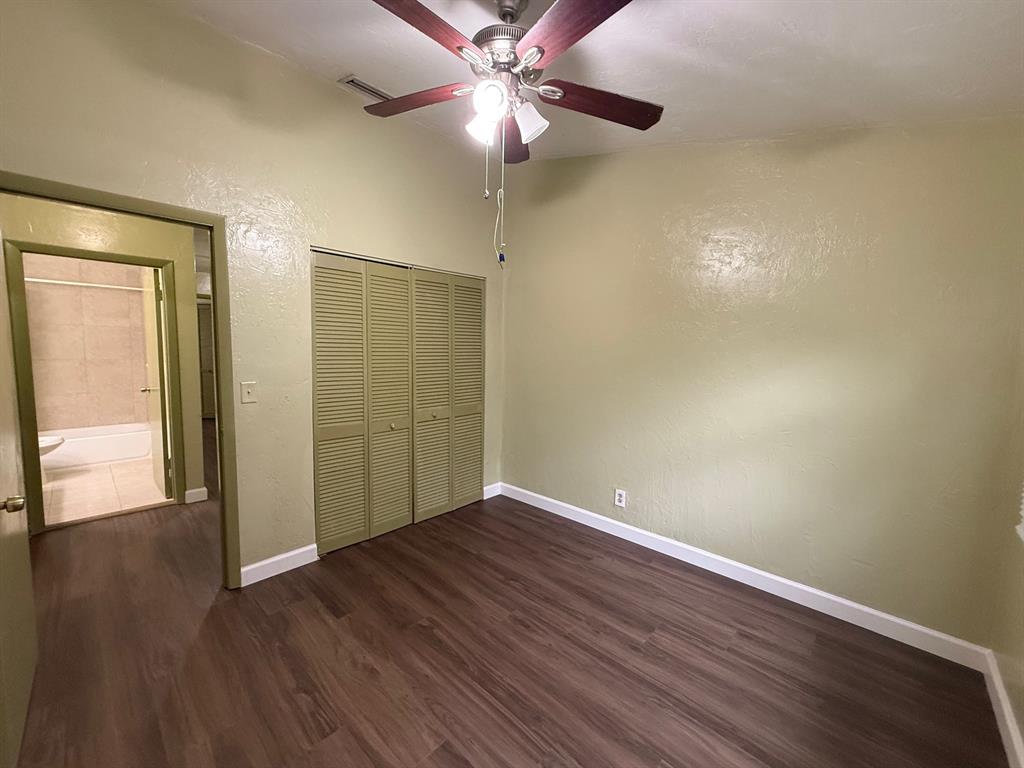 11571 Northwest 35th Street, Unit 11571 Coral Springs, FL 33065 - Photo 22 of 29 a view of an empty room with wooden floor