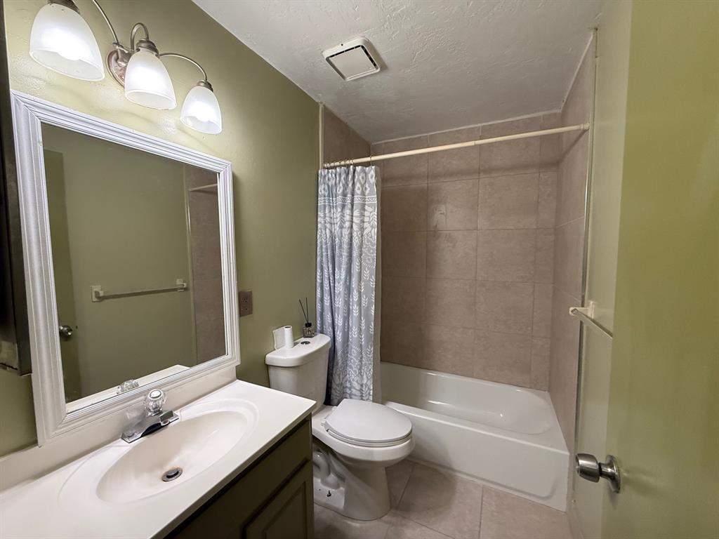 11571 Northwest 35th Street, Unit 11571 Coral Springs, FL 33065 - Photo 24 of 29 a bathroom with a sink a toilet and shower