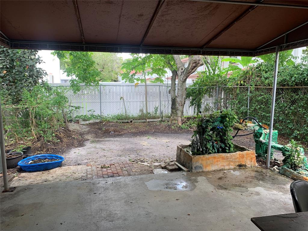 11571 Northwest 35th Street, Unit 11571 Coral Springs, FL 33065 - Photo 29 of 29 a backyard of a house with a fountain