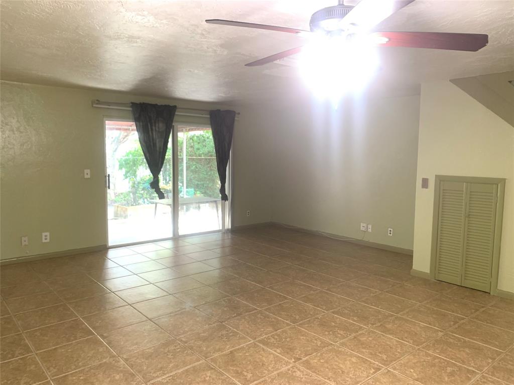 11571 Northwest 35th Street, Unit 11571 Coral Springs, FL 33065 - Photo 6 of 29 a view of an empty room with a window