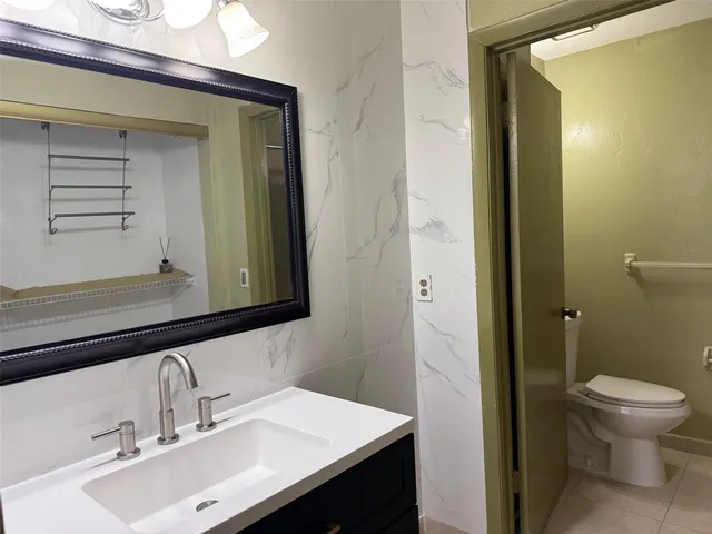 a bathroom with a shower and a toilet