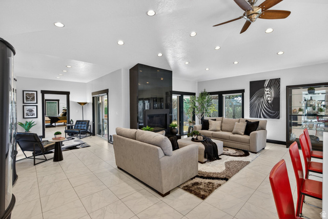 145 Carnesecca Court Mapleton, UT 84664 - Photo 42 of 109 Living room featuring recessed lighting, healthy amount of natural light, a ceiling fan, and light marble finish floors