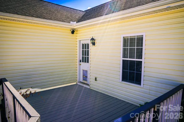 a view of a door and wooden floor