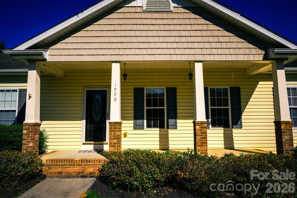 a view of a house with more windows and plants