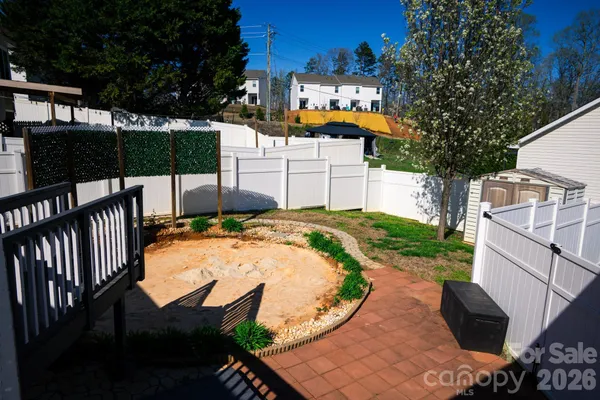a view of a backyard with a patio