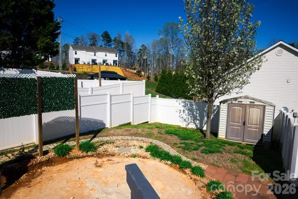 a view of a street with a building in the background