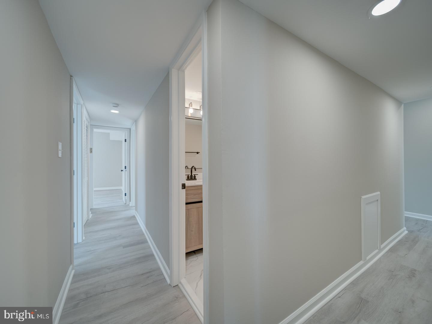 8675 Greenbelt Road, Unit 202 Greenbelt, MD 20770 - Photo 25 of 47 a view of a hallway with wooden floor