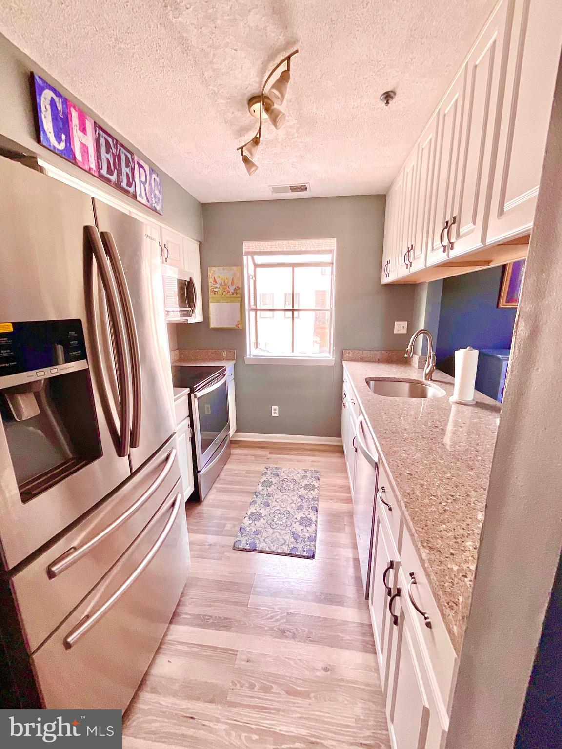 13406 Shady Knoll Drive, Unit 13406 Silver Spring, MD 20904 - Photo 9 of 27 KItchen - galley view